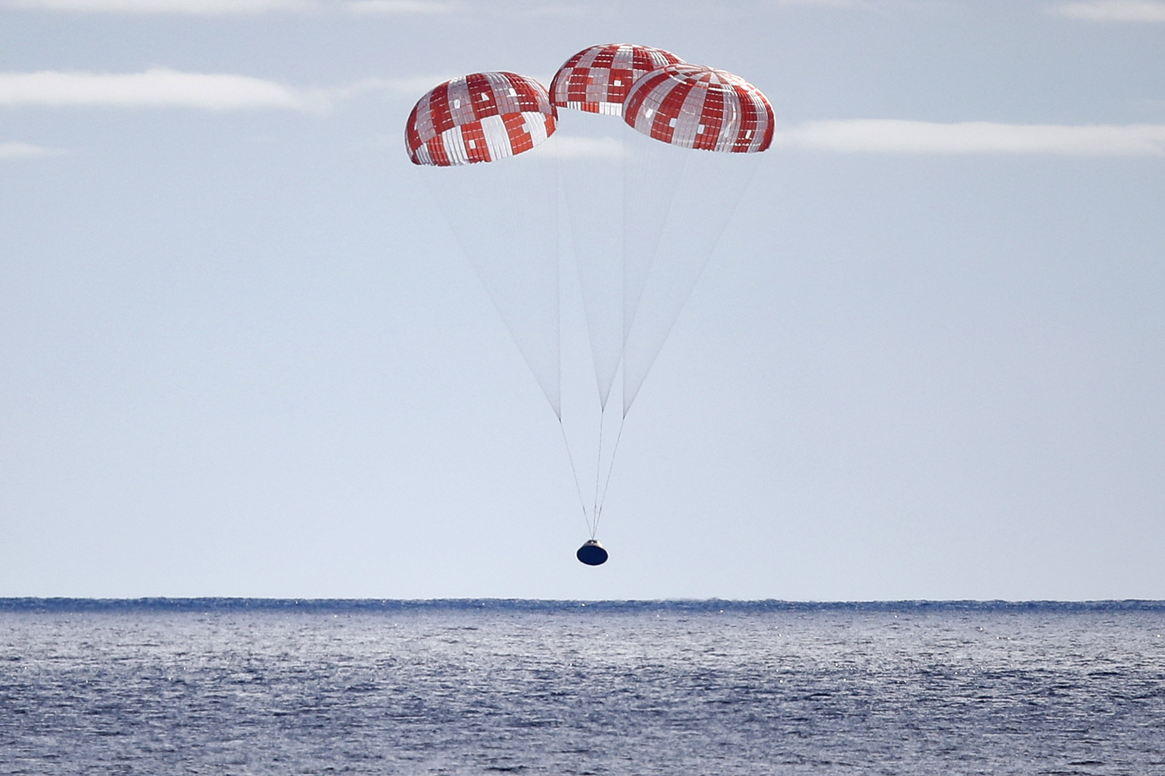 NASA’s Orion capsule splashes down in the Pacific Ocean off the coast of Baja California, Mexico after a successful uncrewed Artemis I moon mission on December 11, 2022.